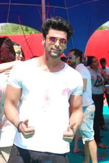 Kushal Tandon poses for the media at Holi Celebrations