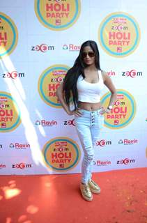 Poonam Pandey poses for the media at Zoom Holi Bash