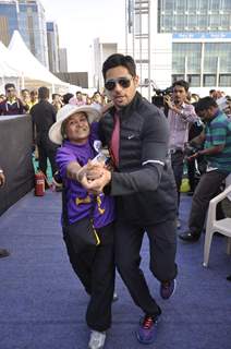 Sidharth Malhotra shakes a leg with a fan at DNA Race