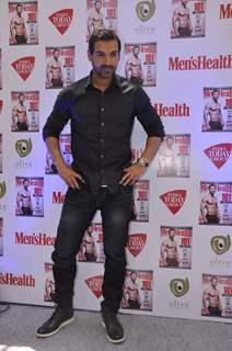 John Abraham poses for the media at the Launch of Men's Health March Edition