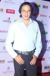 Rahul Roy poses for the media at Smile Foundation Charity Fashion Show