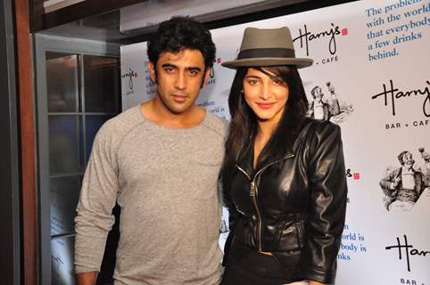 Amit Sadh and Shruti Hassan pose for the media at the Launch of Harry's Bar & Cafe