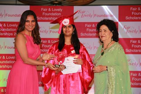 Lara Dutta giving scholarship to the winner at Fair & Lovely Foundation Event