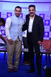 Aamir Khan and Kamal Haasan pose for the media at FICCI Frames 2015 Inaugural Session