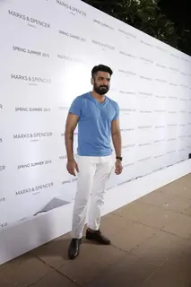 Eijaz Khan poses for the media at Marks & Spencers Spring/Summer 2015 Collection Launch