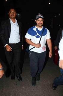 Aamir Khan poses for the media while returning from Disneyland Trip