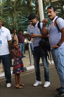 Harbhajan Singh Autographs for a Kid at Airport