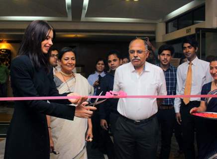 Kalki Koechlin cuts a ribbon at the Annual Film Festival of India Habitat Centre