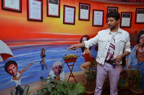 Irrfan Khan checks out the wall paintings at the Promotions of Piku on Red FM