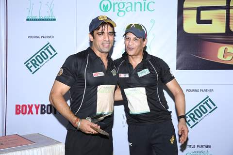 Mohit Malik receives a trophy at Gold Charity Match