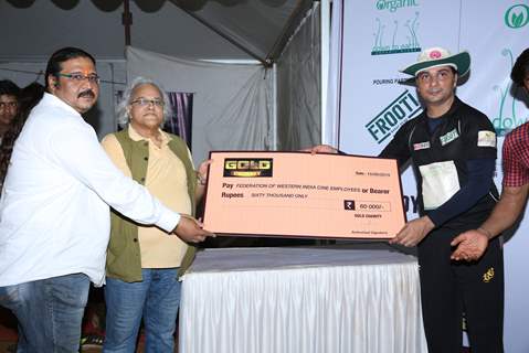 Varun Badola receives an award at Gold Charity Match