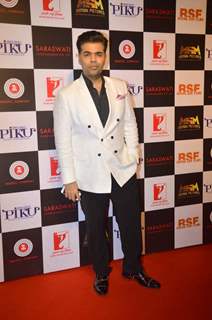 Karan Johar poses for the media at the Success Bash of Piku