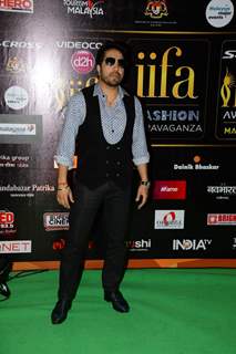 Mika Singh poses for the media at IIFA 2015 Day 2