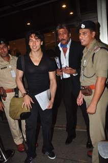 Jackie Shroff and Tiger Shroff pose for media while leaving for IIFA 2015