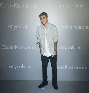 Justin Bieber poses for the media at Calvin Klein Jeans Music Event in Hong Kong