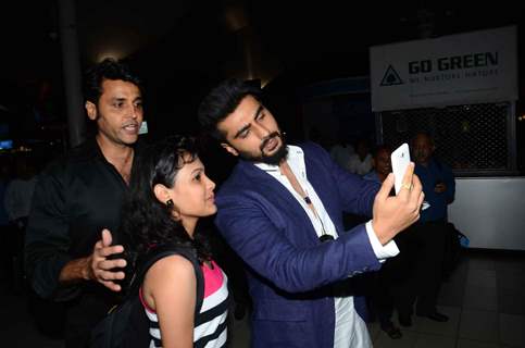 Arjun Kapoor clicks a selfie with a fan at the Airport