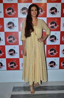 Tabu poses for the media at the Promotions of Drishyam on Fever FM
