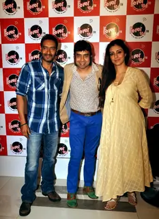 Ajay Devgn and Tabu pose for the media at the Promotions of Drishyam on Fever FM