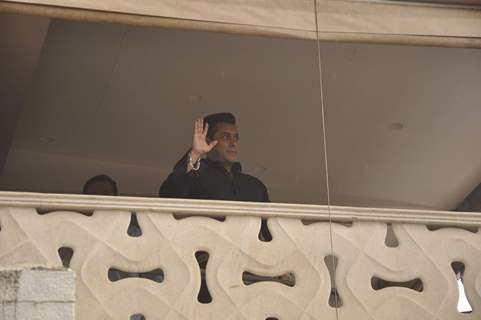 Salman Khan waves to his fans from his balcony during the occassion of Eid