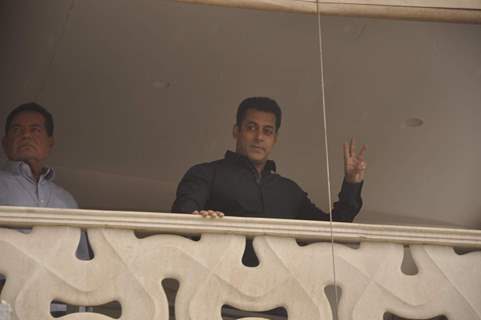 Salman Khan waves to his fans from his balcony during the occassion of Eid