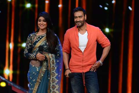 Ajay Devgn and Shriya Saran pose for the media at the Promotions of Drishyam on Nach Baliye 7