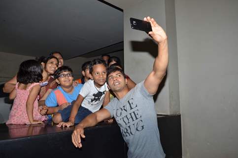 Varun Dhawan Clicks a Picture with Kids at Screening of Welcome Back