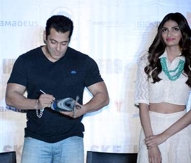 Salman Khan Signs the Shoe During the Press Meet of 'Hero' in Gurgaon