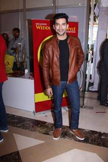 Diganth poses for the media at Glitter 2015 Event