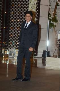 Shah Rukh Khan poses for the media at Mukesh and Nita Ambani's Bash