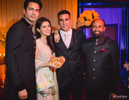 Akshay Kumar Poses with the Newly Married Couple Asin & Rahul Sharma at their Wedding Reception
