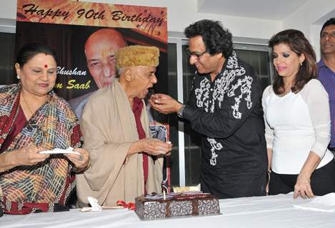 Talat Aziz feeding cake to Khayyam Saab on his 90th Birth Anniversary