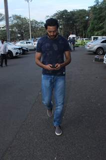 Engrossed: Riteish Deshmukh Snapped at Airport