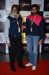 Amitabh Bachchan and Abhishek Bachchan pose for the media at Pro Kabaddi Match