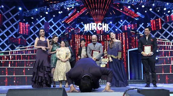 Udit Narayan pays respect to the stage at Mirchi Music Awards 2016