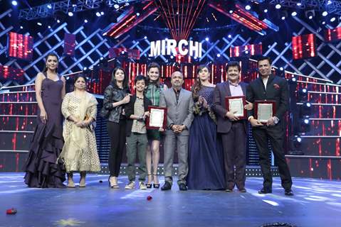 Celebs pose for the media at Mirchi Music Awards 2016