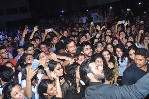 Fawad Khan takes a selfie with students at Mithibai college during promotions of Kapoor & Sons