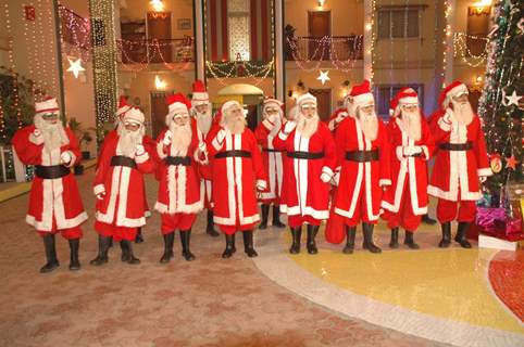 All cast dressed as SantaClaus