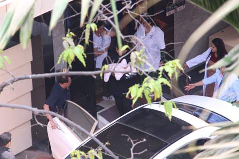 Karan Johar taking his babies home from hospital