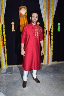 Tusshar Kapoor captured in a striking red kurta