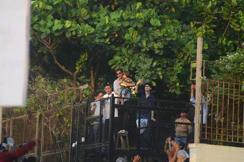 Shah Rukh Khan greets his fans with AbRam