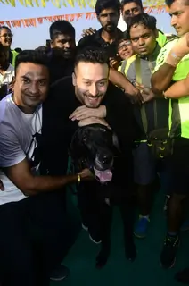 Tiger Shroff poses for a click with a dog
