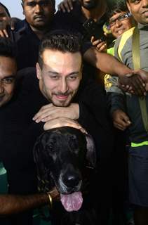 Tiger Shroff with a Dog at the event