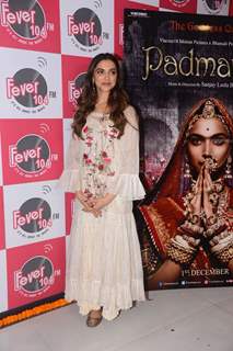 Deepika poses with the poster of her film, Padmavati