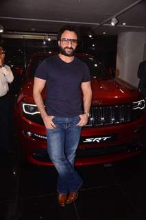 Dressed in casuals, Saif poses with his Jeep