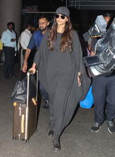 Sonam Kapoor wearing a grey maxi dress