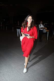 Disha charms in a casual red dress