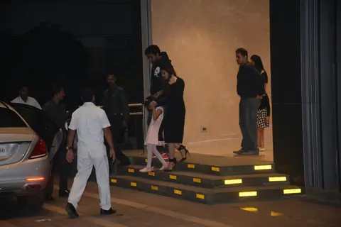 Aishwarya, Abhishek with Aaradhya outside an eatery