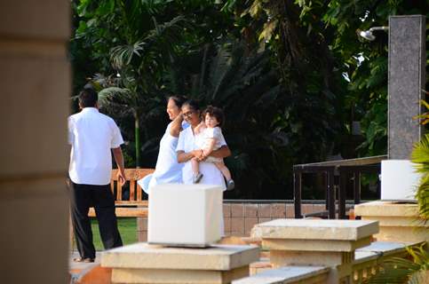 Taimur Ali Khan walking by the poolside