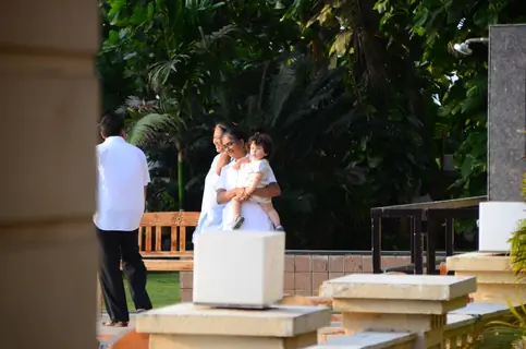 Taimur Ali Khan walking by the poolside