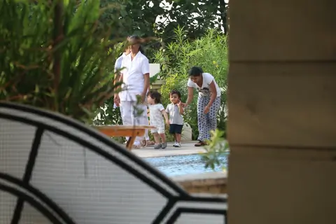 Taimur Ali Khan walking by the poolside